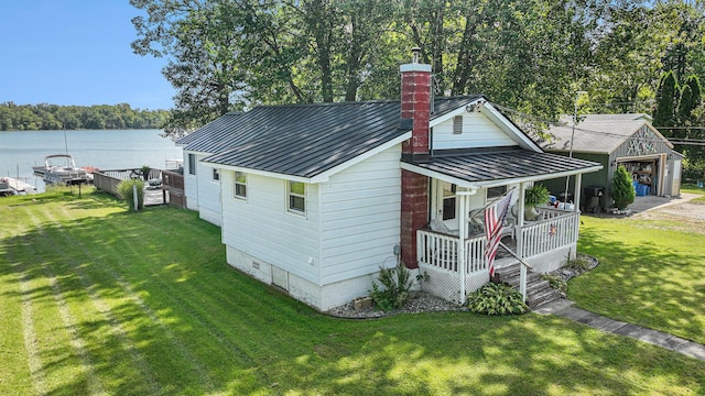 76 Sundago Park St, Hastings, MI 49058 - view of outbuilding with covered porch and a water view