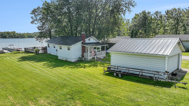 76 Sundago Park St, Hastings, MI 49058 - view of green lawn featuring a water view and an outdoor structure