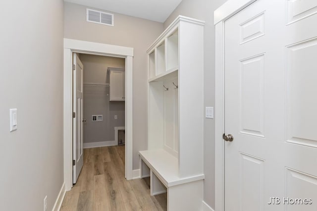 mudroom with light hardwood / wood-style flooring