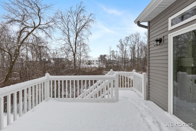 view of snow covered deck