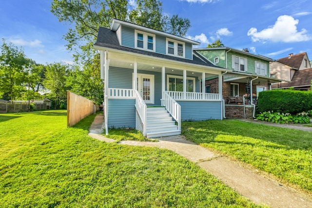 view of front of home with a porch and a front lawn