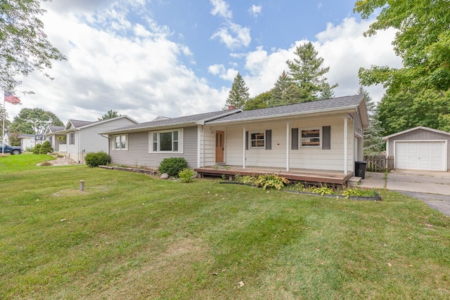 single story home featuring an outbuilding, a porch, a garage, and a front lawn