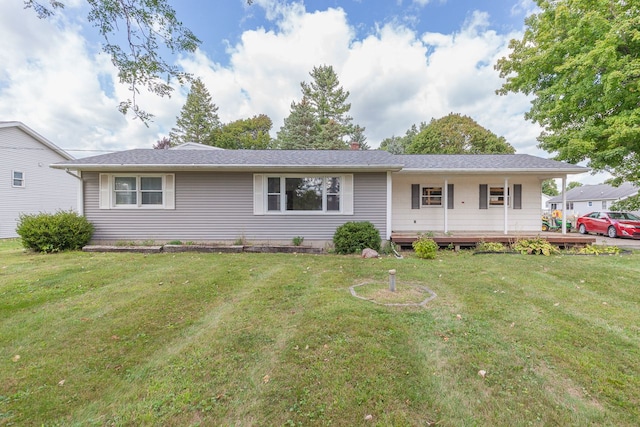 ranch-style home with a front lawn