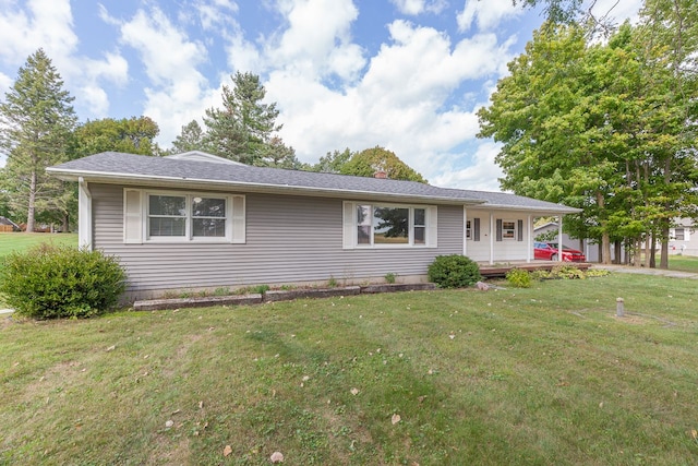 single story home with covered porch and a front yard