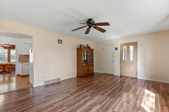 unfurnished living room with hardwood / wood-style floors and ceiling fan