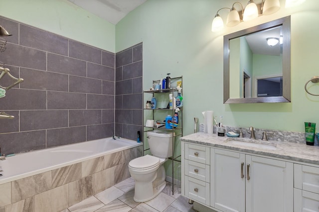 bathroom featuring a relaxing tiled tub, toilet, and vanity