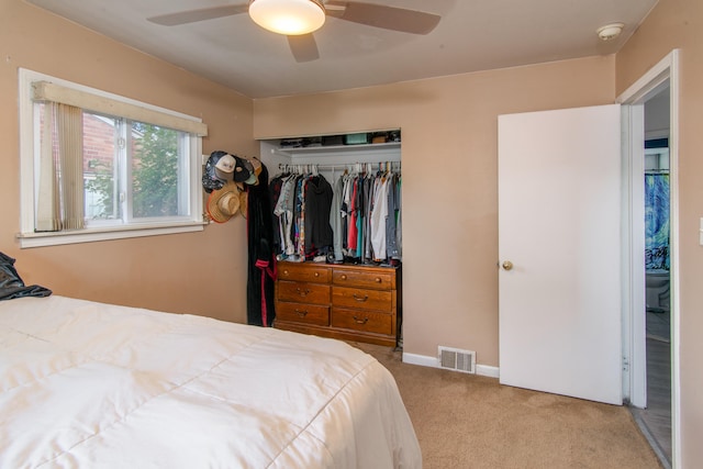 bedroom featuring carpet floors, a closet, and ceiling fan