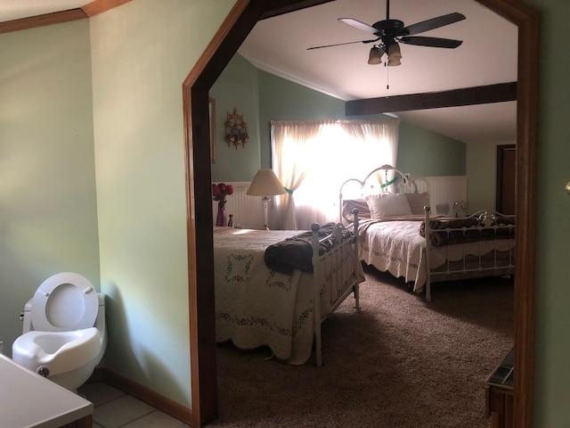 bedroom featuring carpet flooring, ceiling fan, lofted ceiling, and ornamental molding