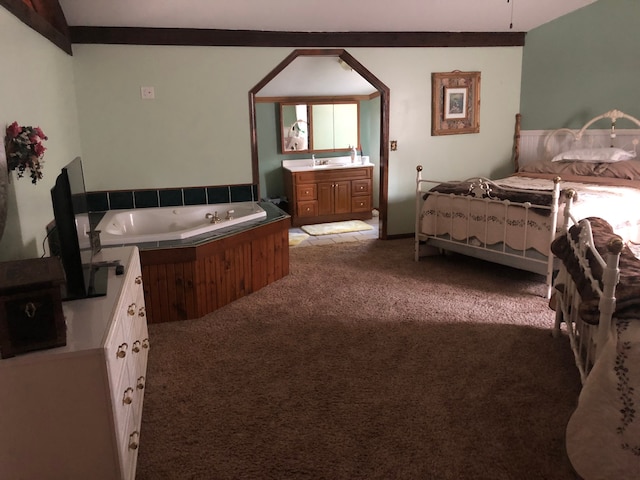 carpeted bedroom featuring sink