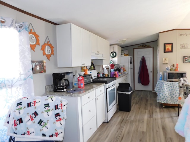 kitchen with light hardwood / wood-style flooring, vaulted ceiling, white appliances, white cabinets, and ornamental molding