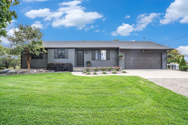 single story home featuring a garage and a front lawn