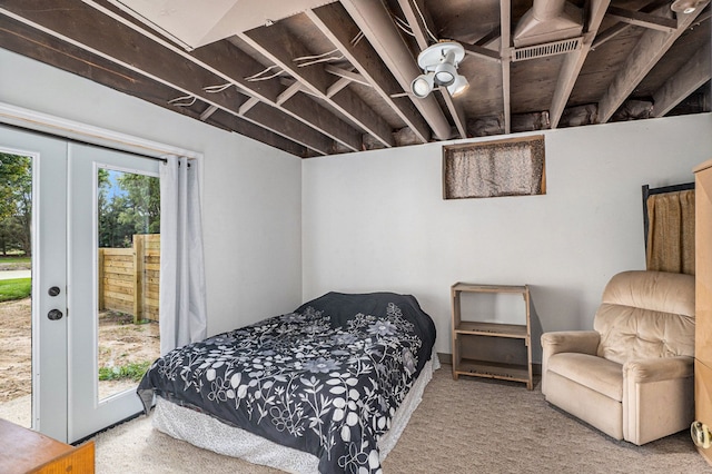 bedroom featuring access to outside, multiple windows, and carpet floors