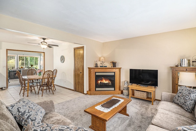 living room with light tile patterned floors and ceiling fan