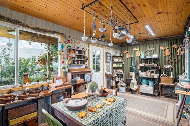 dining area featuring wood ceiling