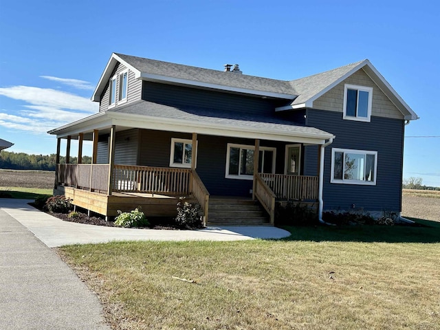 country-style home featuring a front lawn and a porch