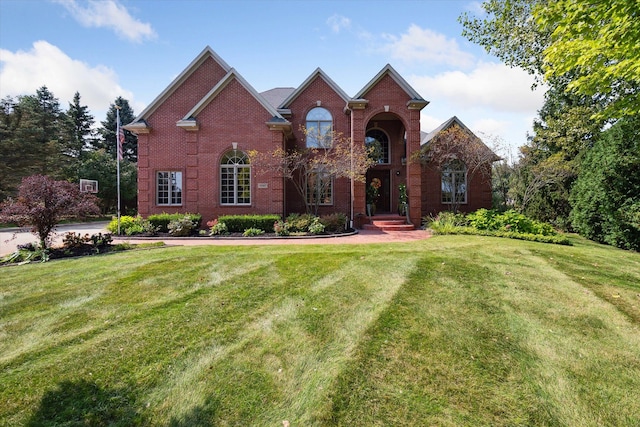 view of property featuring a front lawn