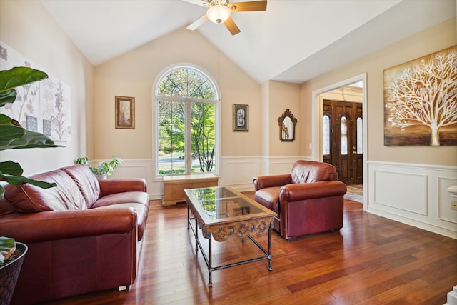 living room with vaulted ceiling, ceiling fan, and dark wood-type flooring