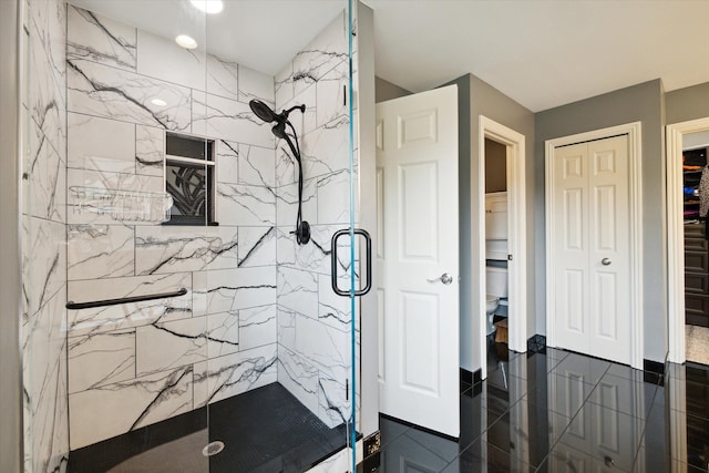 bathroom featuring tile patterned flooring and a shower with door