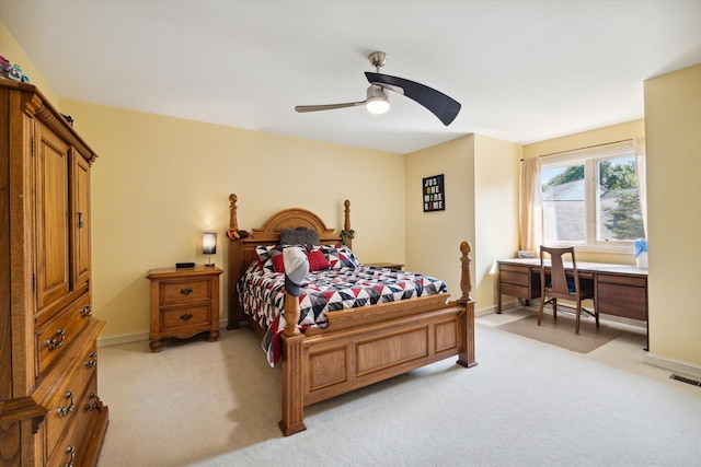 bedroom featuring ceiling fan and light colored carpet