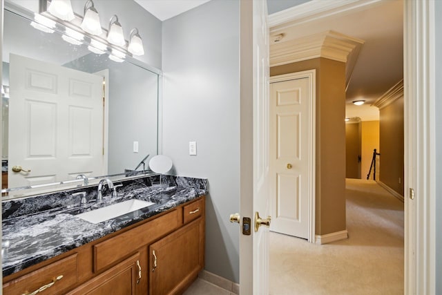 bathroom with vanity and ornamental molding