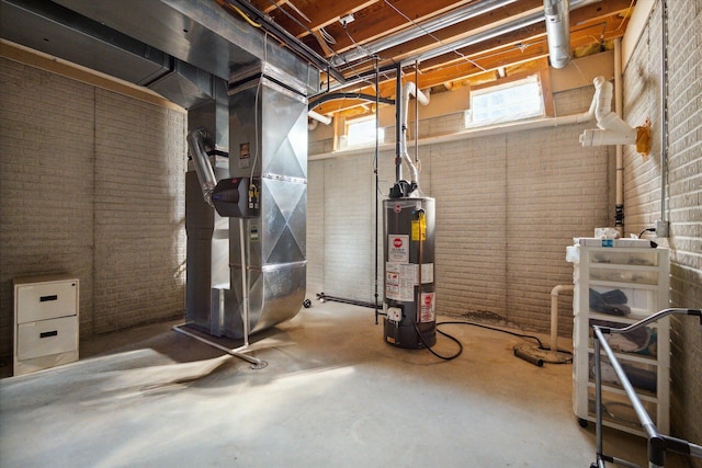 basement with heating unit, water heater, and brick wall