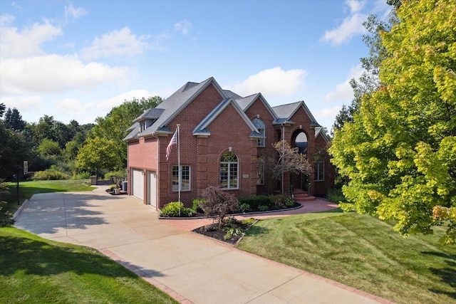 view of front of home with a garage and a front yard