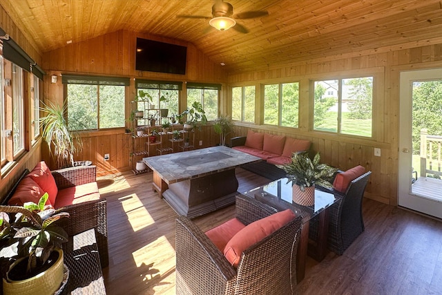 sunroom / solarium with ceiling fan, a healthy amount of sunlight, lofted ceiling, and wood ceiling