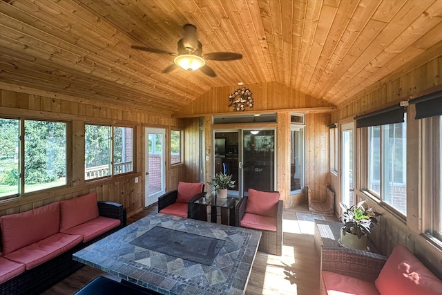 sunroom / solarium with ceiling fan, lofted ceiling, and wooden ceiling