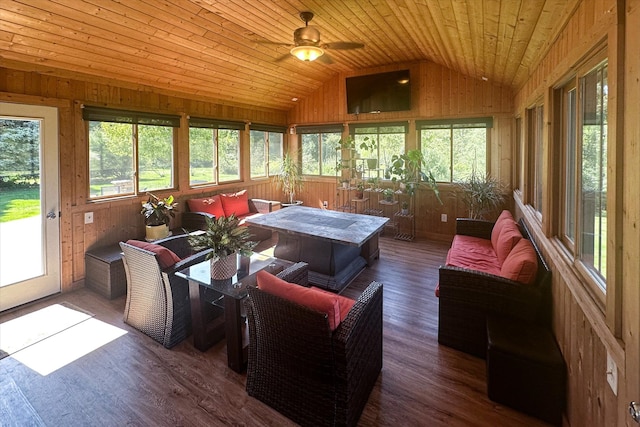 sunroom / solarium featuring a healthy amount of sunlight, wooden ceiling, ceiling fan, and lofted ceiling