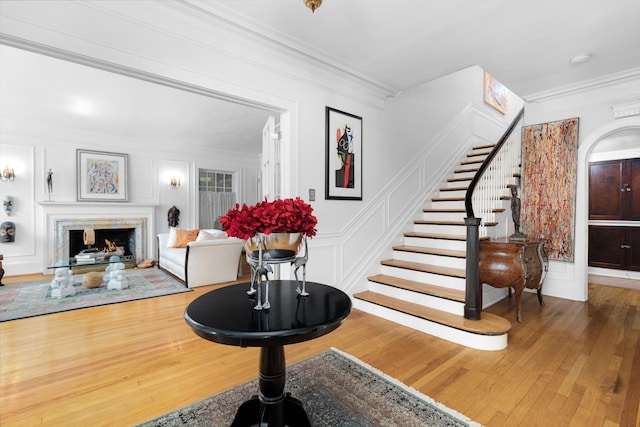 entrance foyer featuring hardwood / wood-style floors and ornamental molding