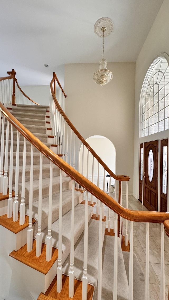 staircase featuring plenty of natural light