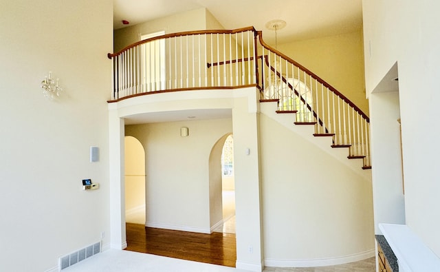 stairway with a towering ceiling