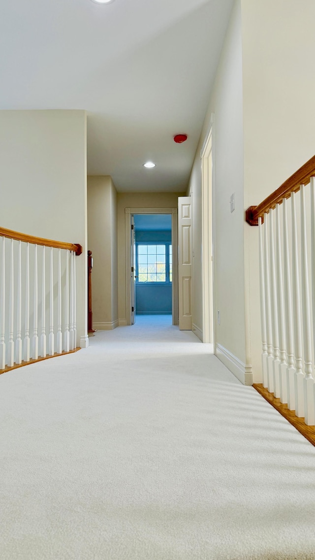 corridor with light carpet