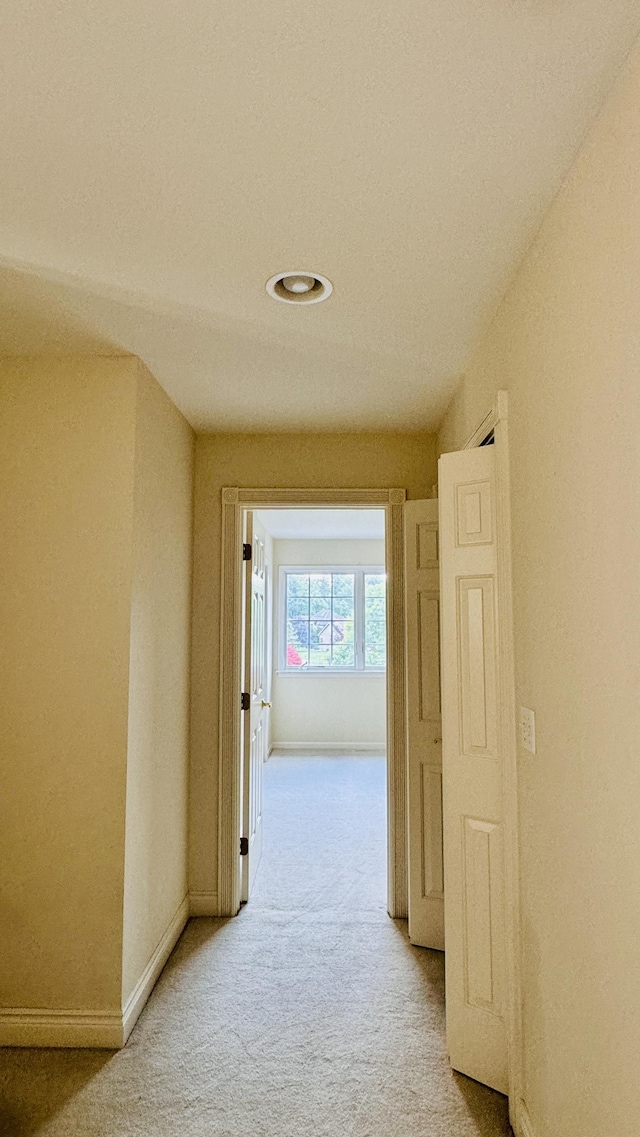 corridor featuring carpet flooring