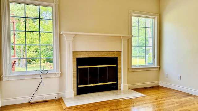 unfurnished living room featuring light wood-type flooring