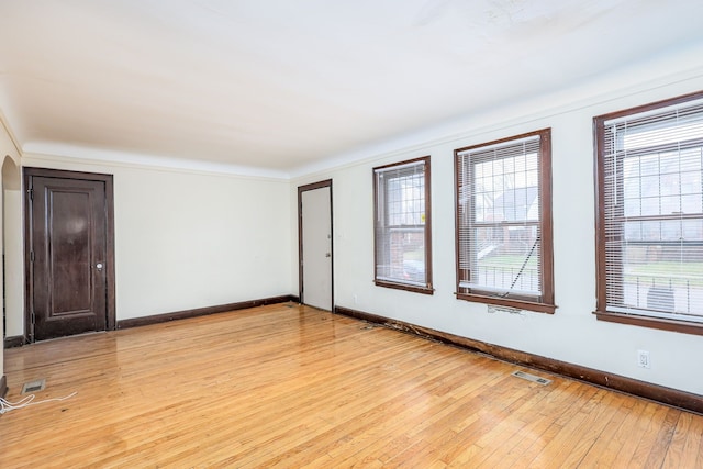 unfurnished room with light hardwood / wood-style floors