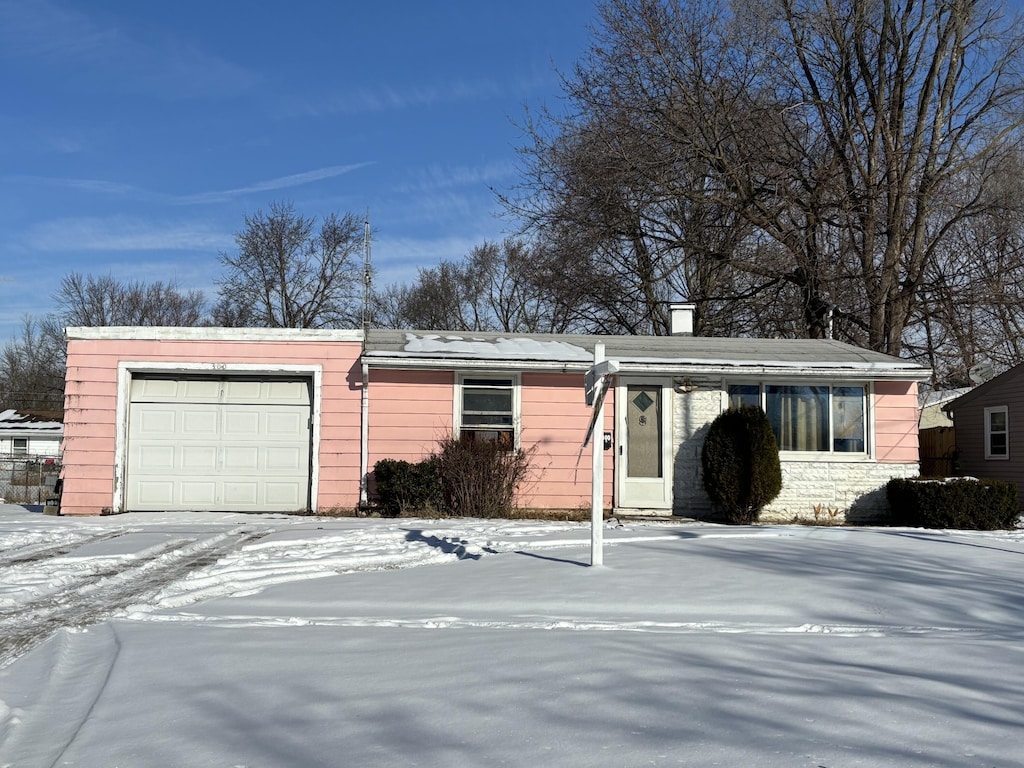 ranch-style house featuring a garage