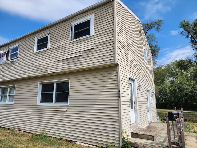 view of home's exterior with a deck