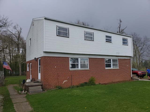 view of property exterior with a lawn