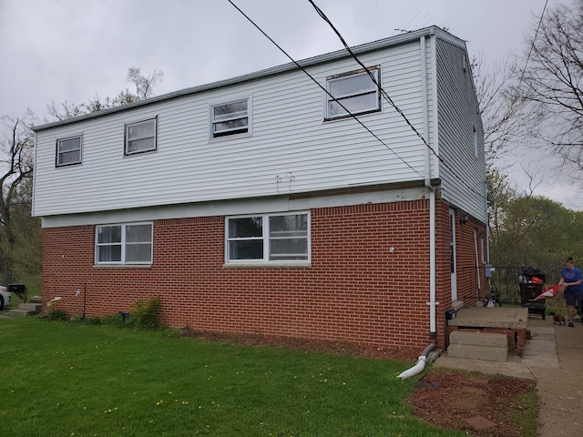 view of home's exterior featuring a yard