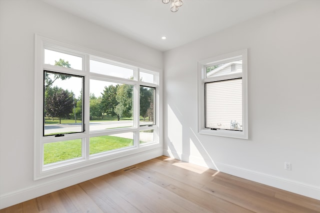 spare room with light wood-type flooring