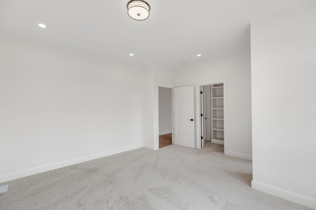 spare room with light colored carpet