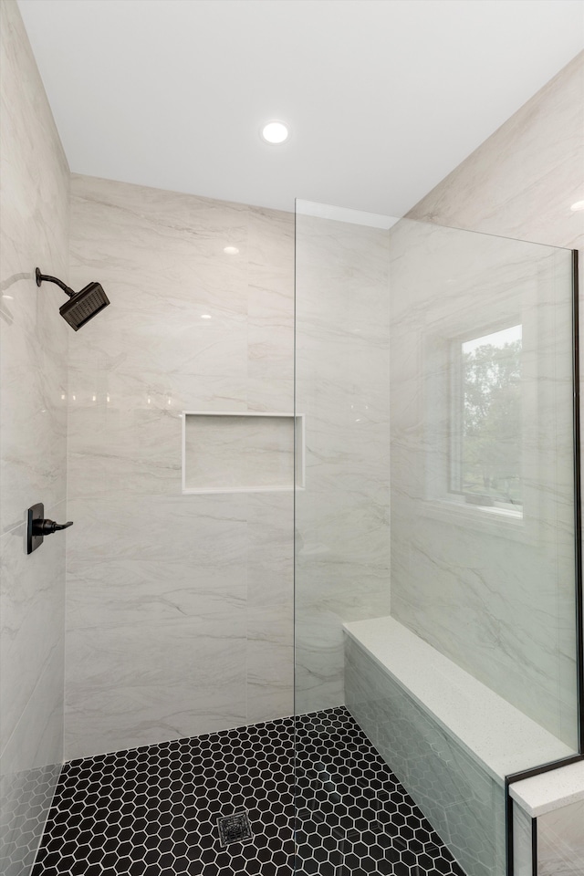 bathroom with tiled shower