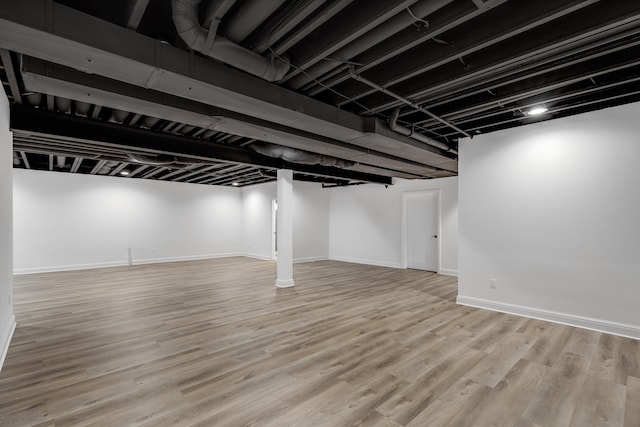 basement featuring light wood-type flooring