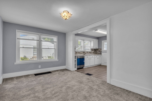 interior space with light colored carpet and sink