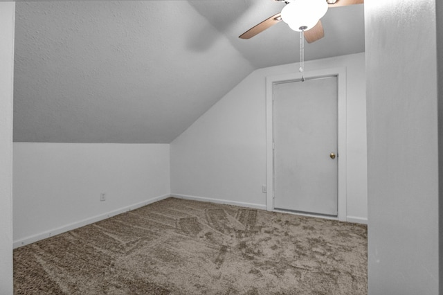 additional living space featuring carpet flooring, ceiling fan, and lofted ceiling