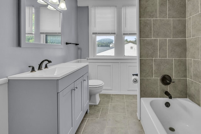 full bathroom featuring tile patterned floors, vanity, toilet, and shower / bath combination