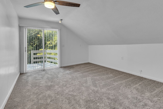 additional living space with carpet flooring, ceiling fan, a textured ceiling, and vaulted ceiling