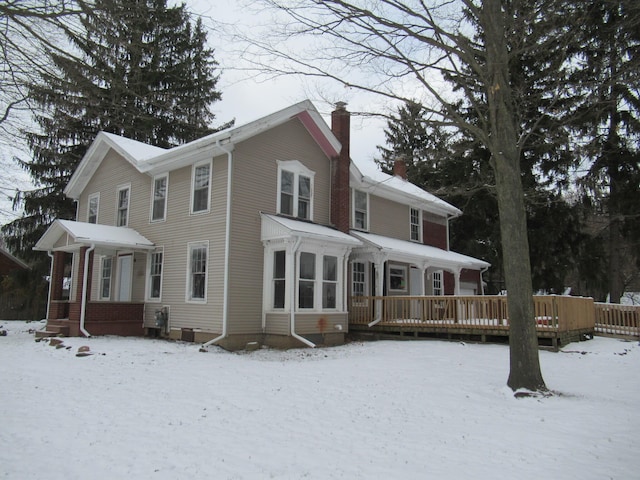 view of front of property with a wooden deck