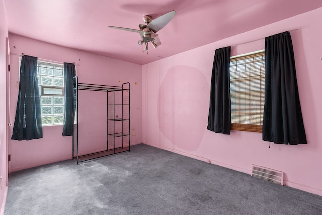 carpeted empty room with ceiling fan